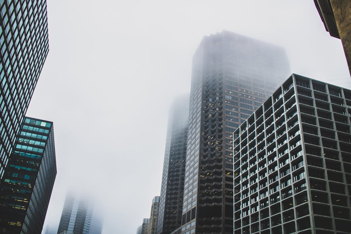 Modern office buildings conveying annual report requirements compliance.