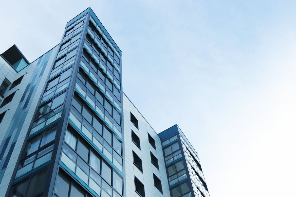 Glass high-rises highlighting corporate duty to file annual reports with the SEC.